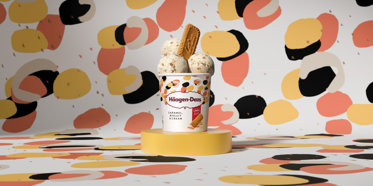 An ice cream pint with a biscuit placed on top.